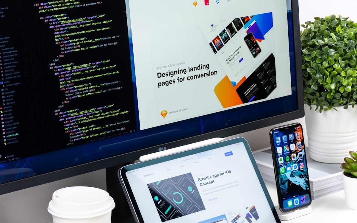 Website designs being built across desktop, tablet, and phone